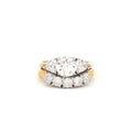 Three Stone Ring with Trillion Side Stones and Five Stone Curved Band