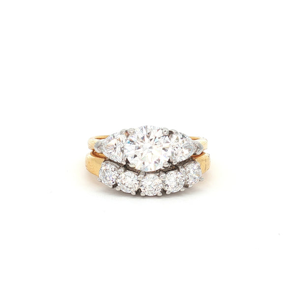 Three Stone Ring with Trillion Side Stones and Five Stone Curved Band