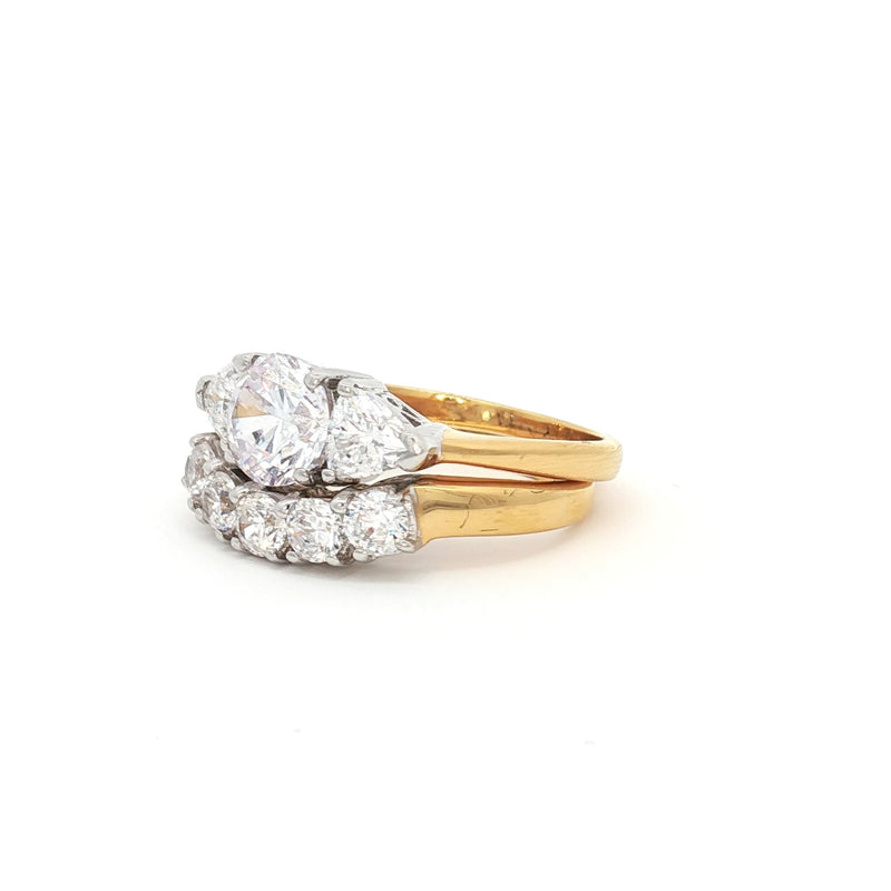 Three Stone Ring with Trillion Side Stones and Five Stone Curved Band