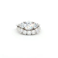 Three Stone Ring with Trillion Side Stones and Five Stone Curved Band
