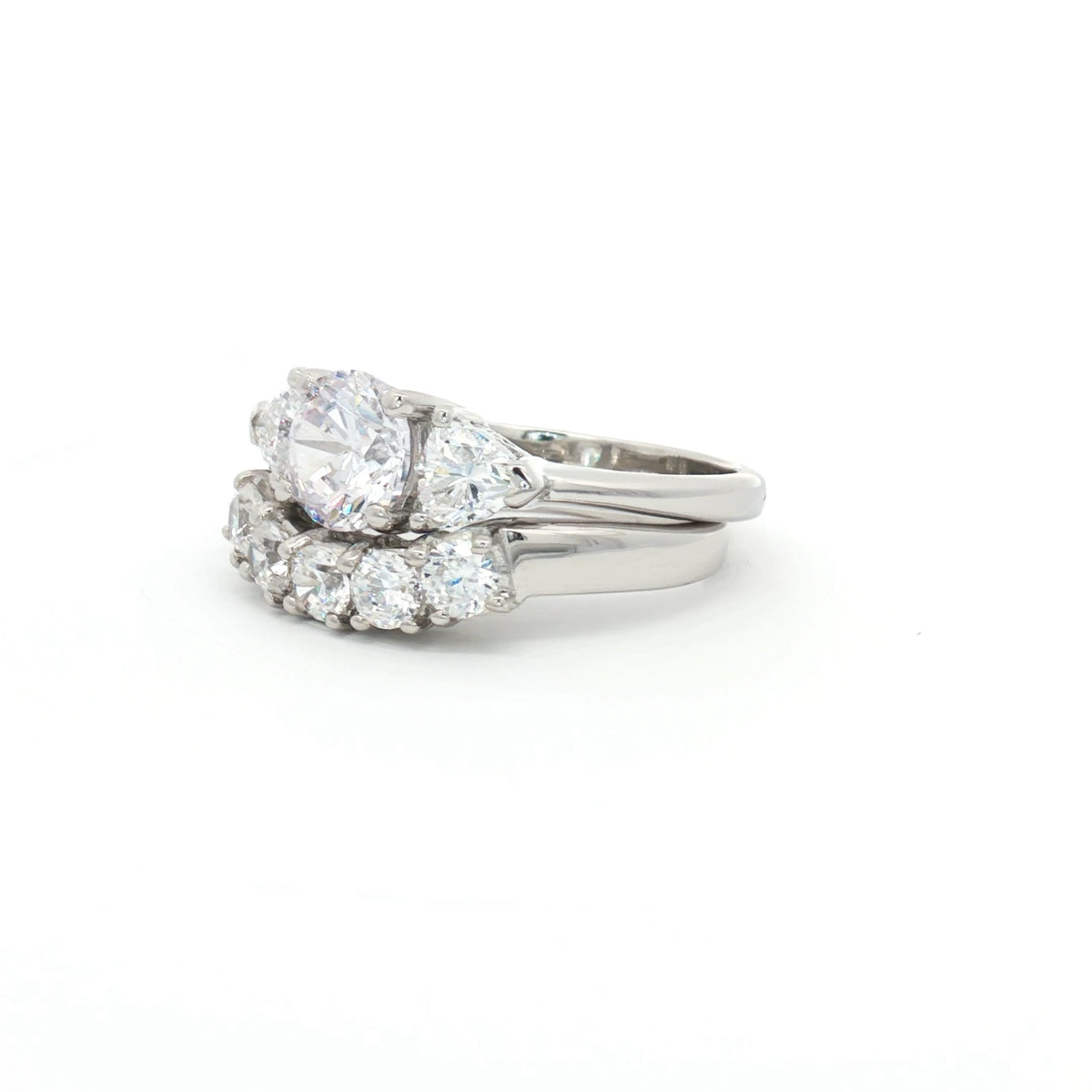 Three Stone Ring with Trillion Side Stones and Five Stone Curved Band