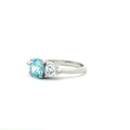 Three Stone Ring with Aqua Marine Brilliant Centre Stone and Trillion Side Stones