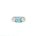 Three Stone Ring with Aqua Marine Brilliant Centre Stone and Trillion Side Stones