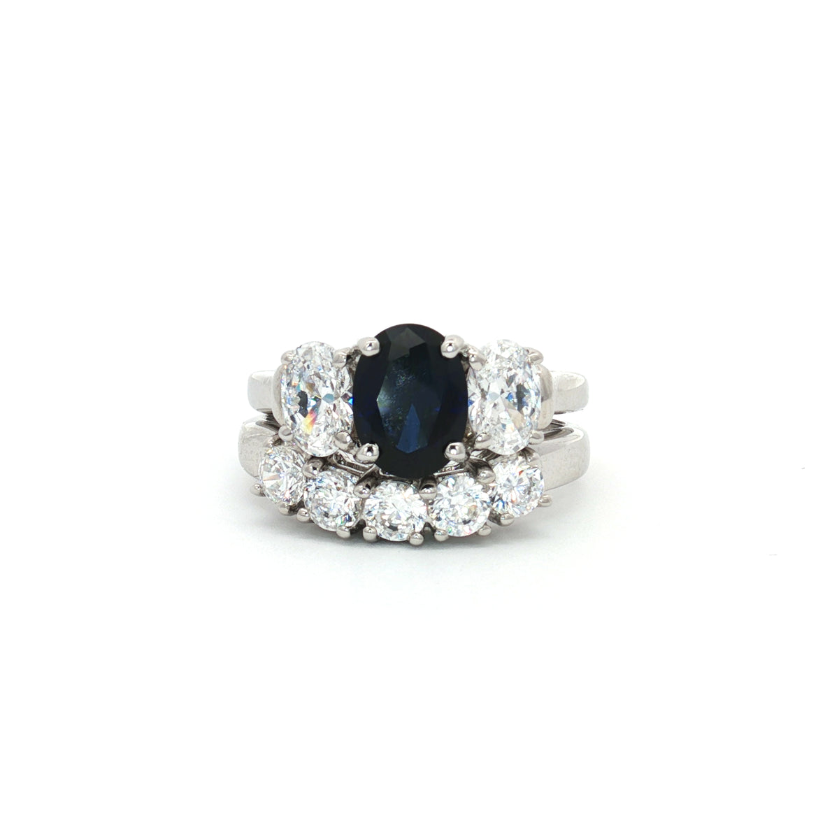 Oval Cut Three Stone Sapphire Ring and Five Stone Curved Band