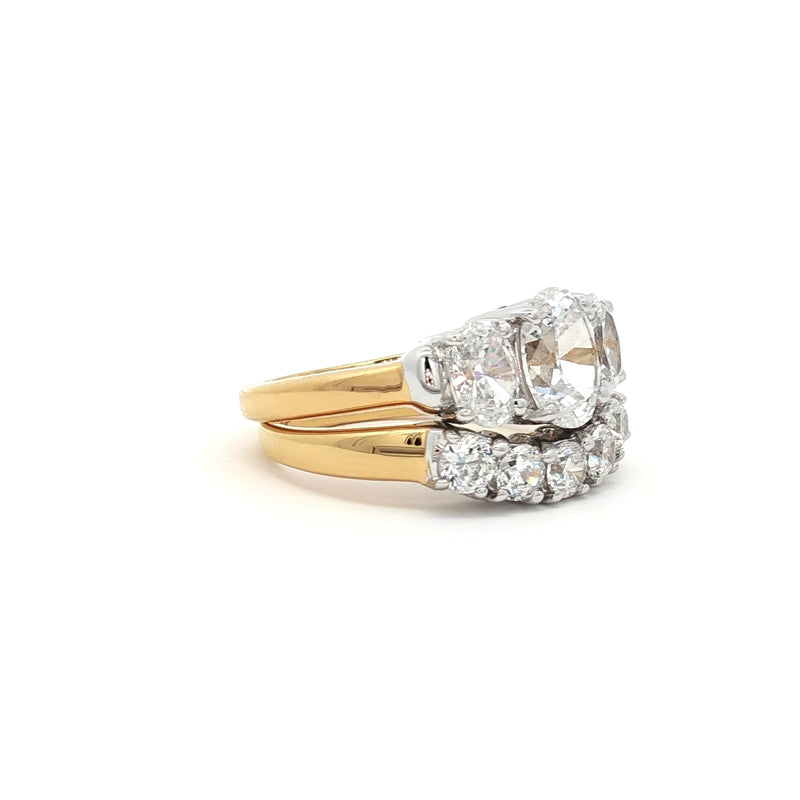 Oval Cut Three Stone Ring and Five Stone Curved Band in Yellow