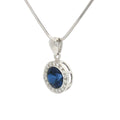The Round Halo Pendant with a Sapphire