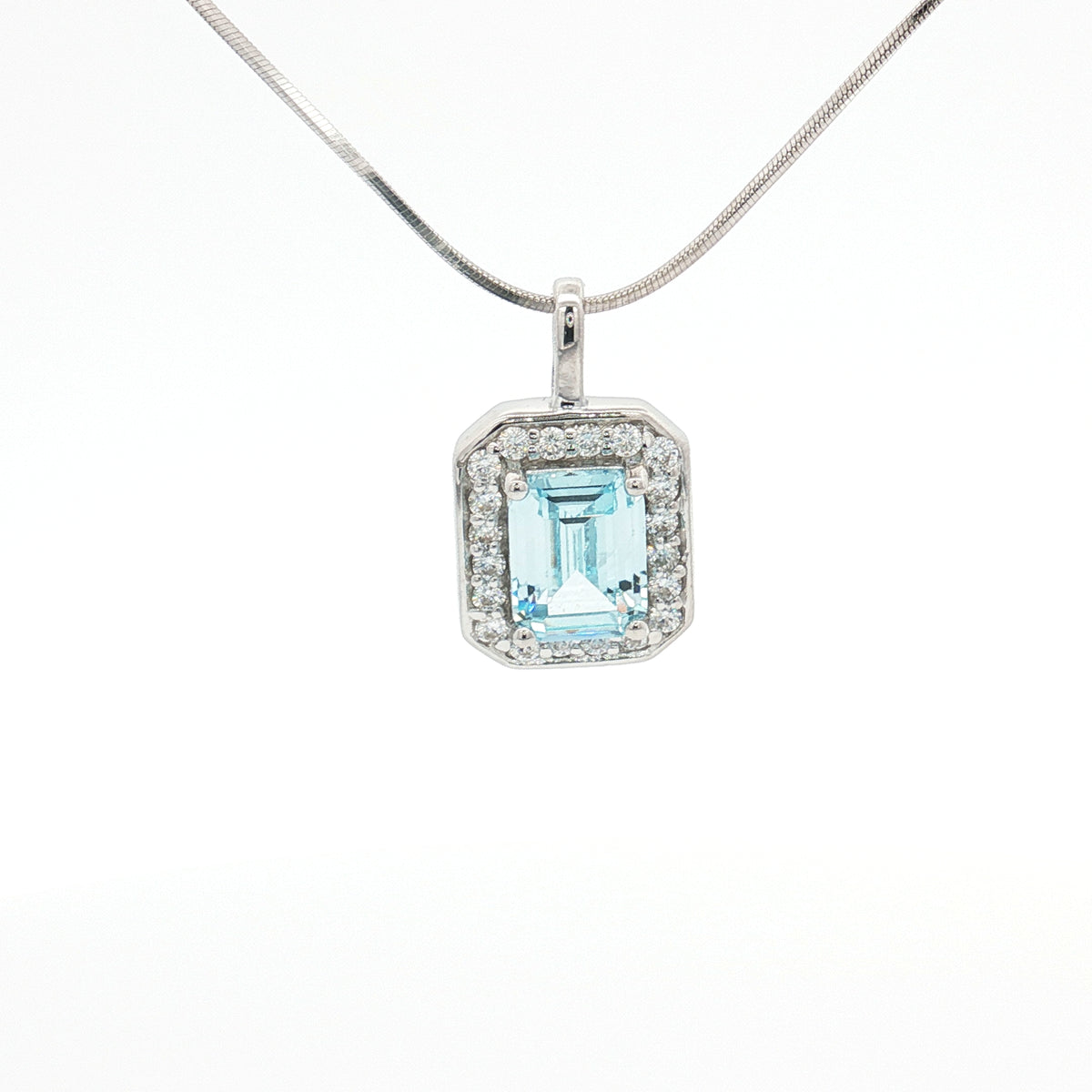 The Emerald Cut Halo Pendant with Aqua Marine