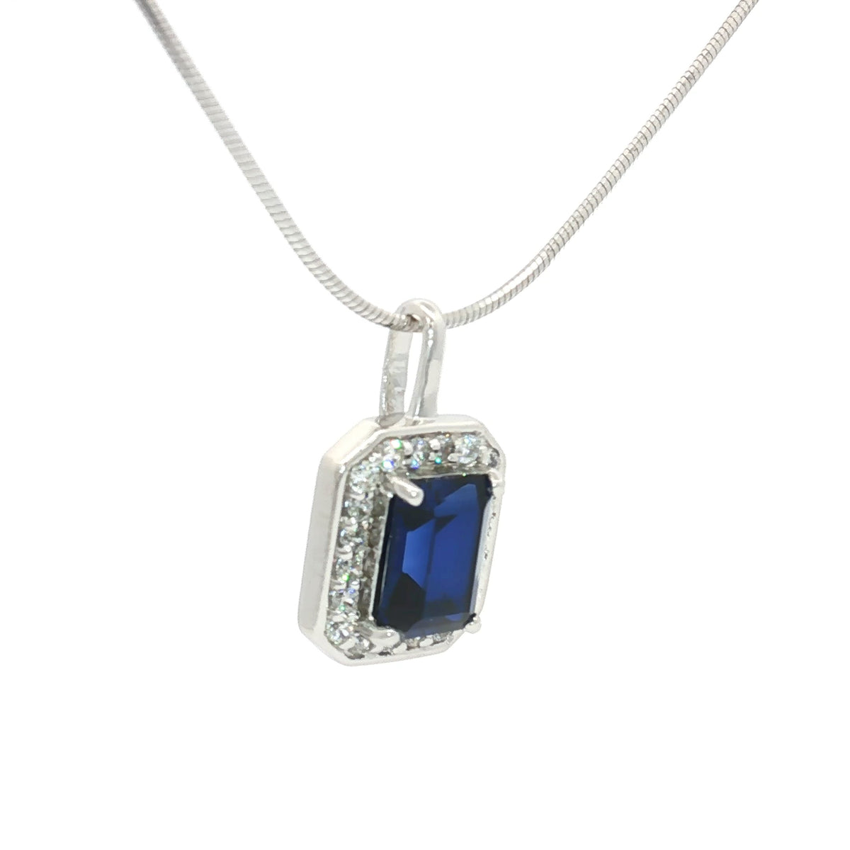 The Emerald Cut Halo Pendant with a Sapphire