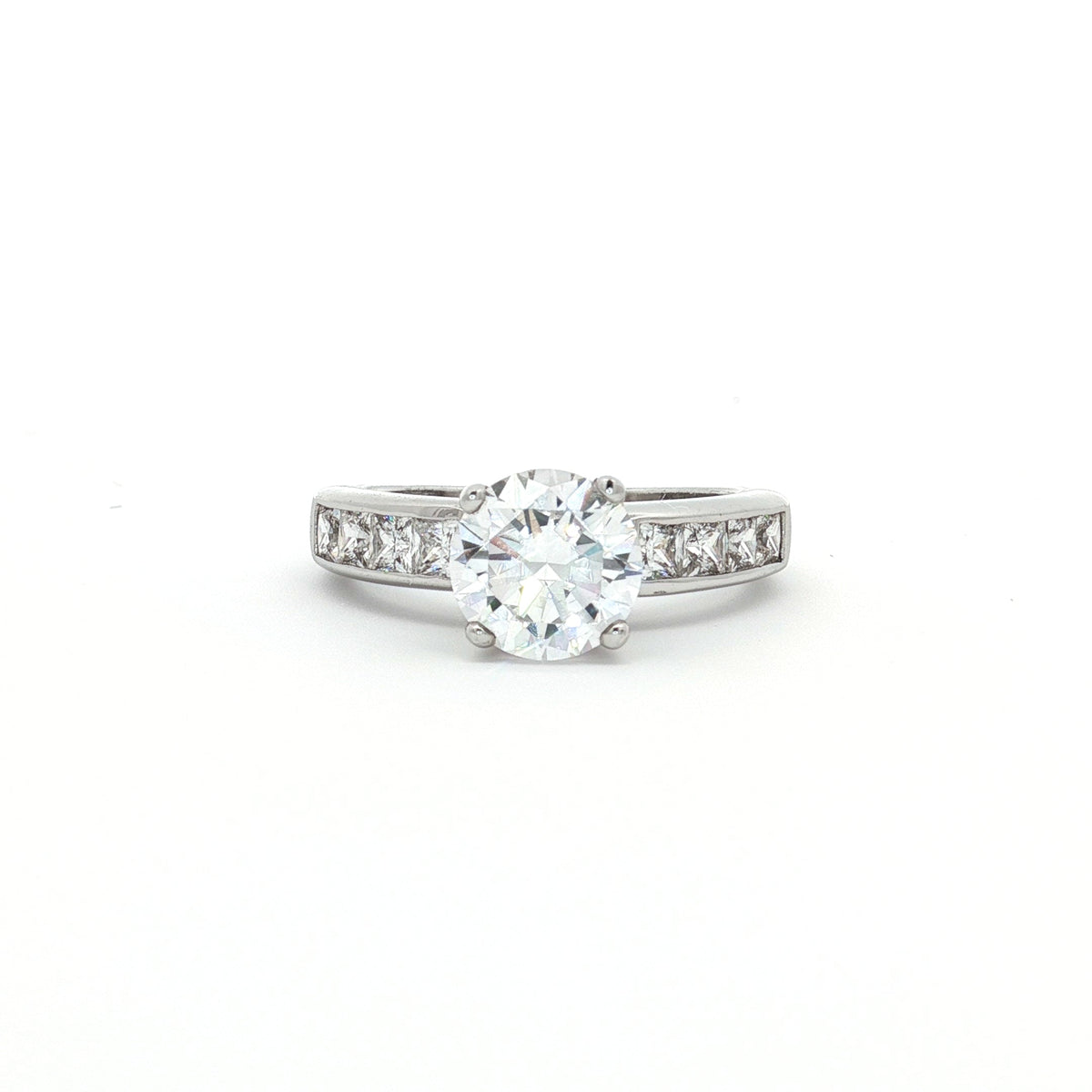 Brilliant Cut Solitaire Ring with Princess Cut Channel Setting