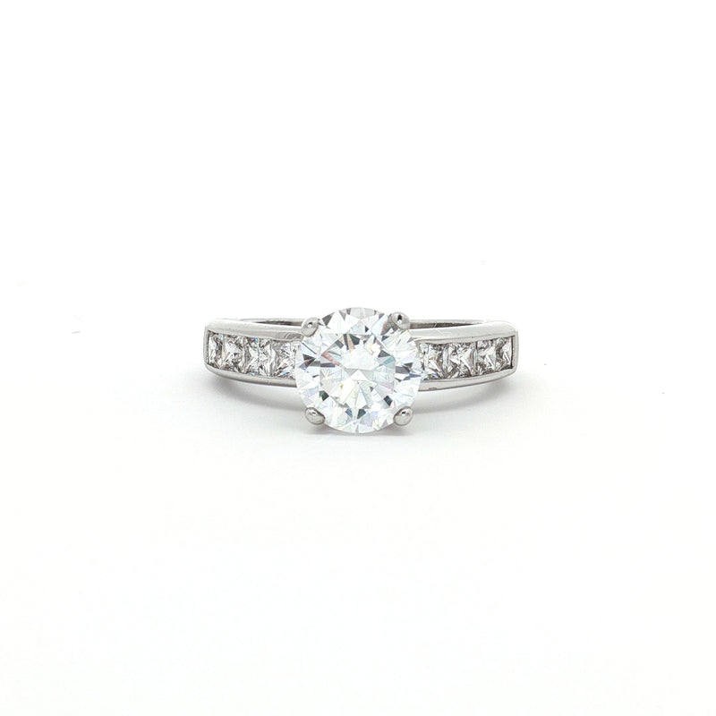 Brilliant Cut Solitaire Ring with Princess Cut Channel Setting
