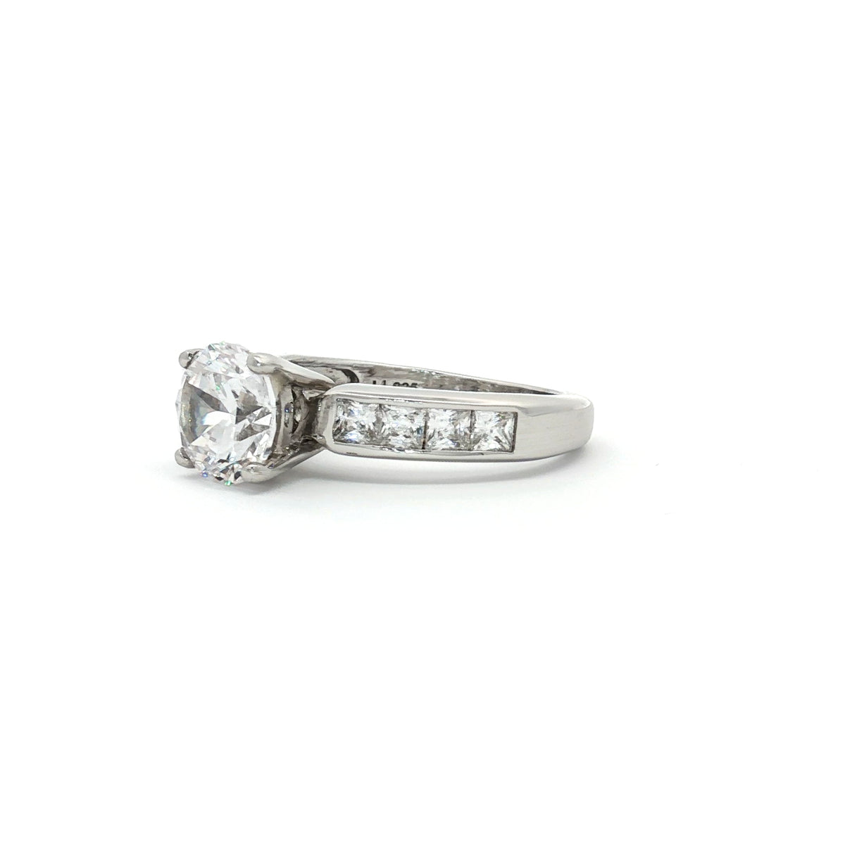 Brilliant Cut Solitaire Ring with Princess Cut Channel Setting