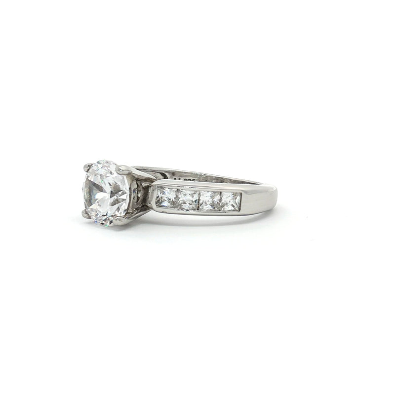 Brilliant Cut Solitaire Ring with Princess Cut Channel Setting