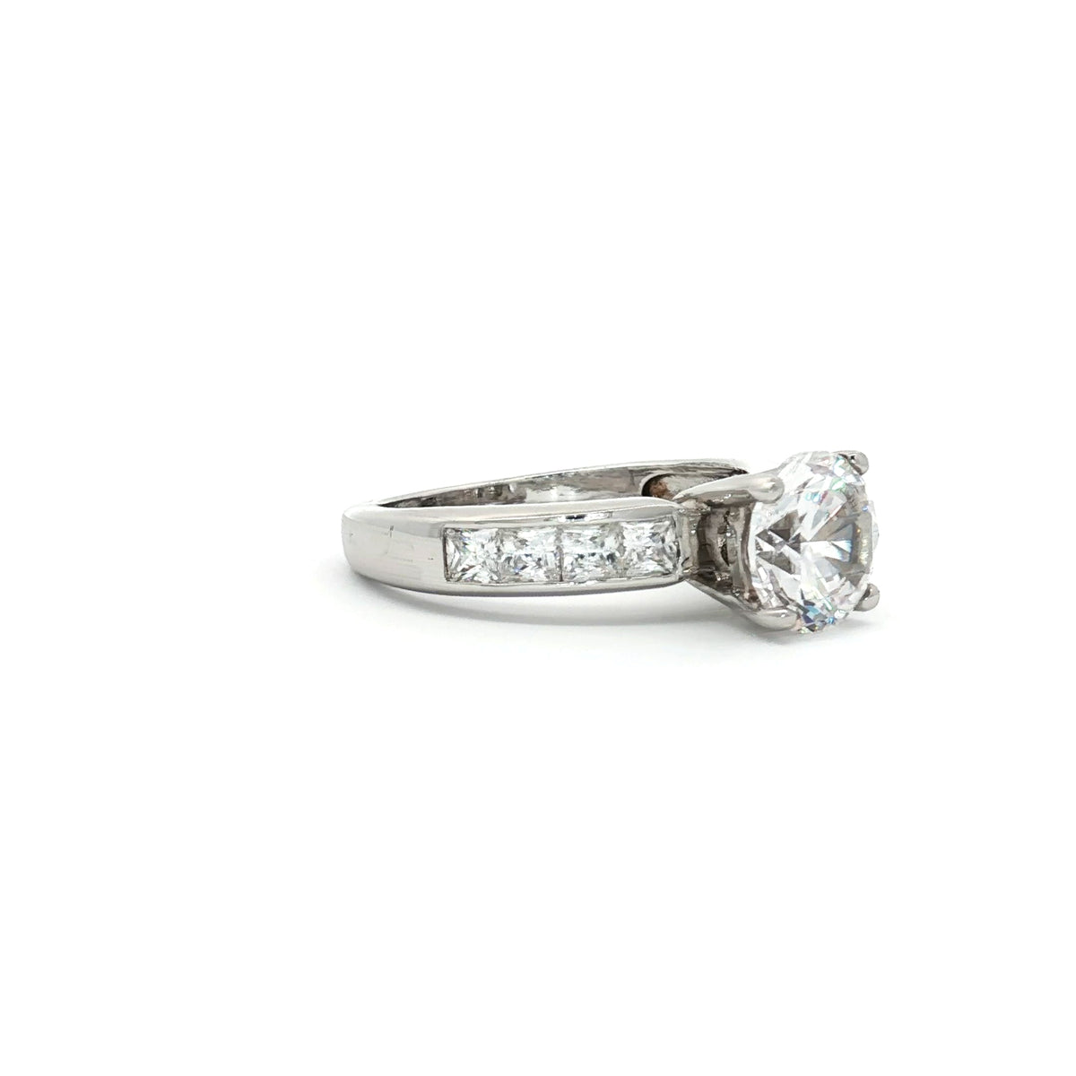 Brilliant Cut Solitaire Ring with Princess Cut Channel Setting