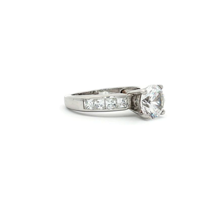 Brilliant Cut Solitaire Ring with Princess Cut Channel Setting