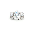 Large Three Stone Brilliant Cut Ring and Seven Stone Curved Band