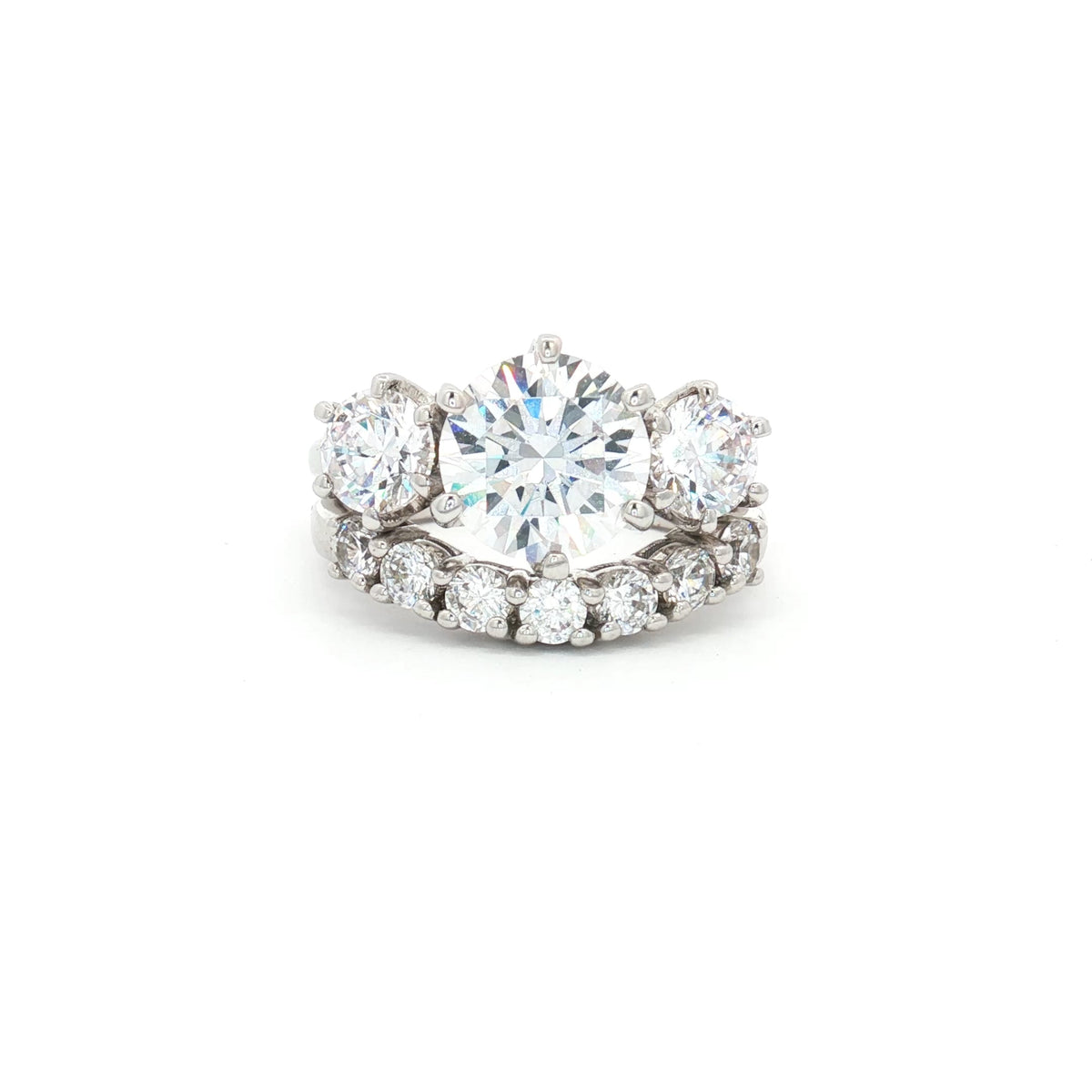 Large Three Stone Brilliant Cut Ring and Seven Stone Curved Band