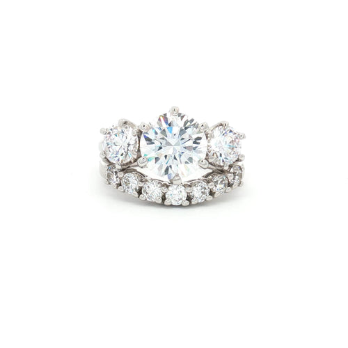 Large Three Stone Brilliant Cut Ring and Seven Stone Curved Band