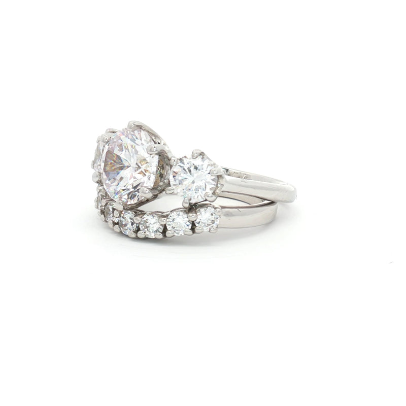 Large Three Stone Brilliant Cut Ring and Seven Stone Curved Band