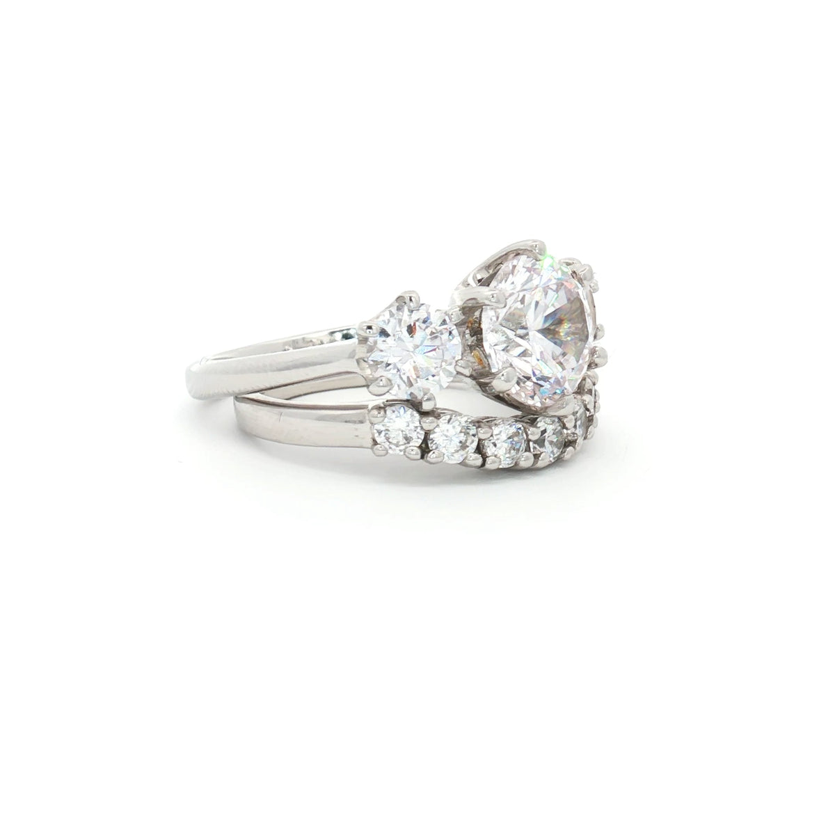 Large Three Stone Brilliant Cut Ring and Seven Stone Curved Band
