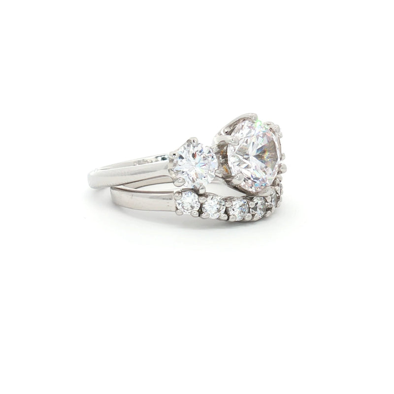 Large Three Stone Brilliant Cut Ring and Seven Stone Curved Band