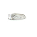Petite Brilliant Cut Solitaire Ring with Princess Cut Channel Setting