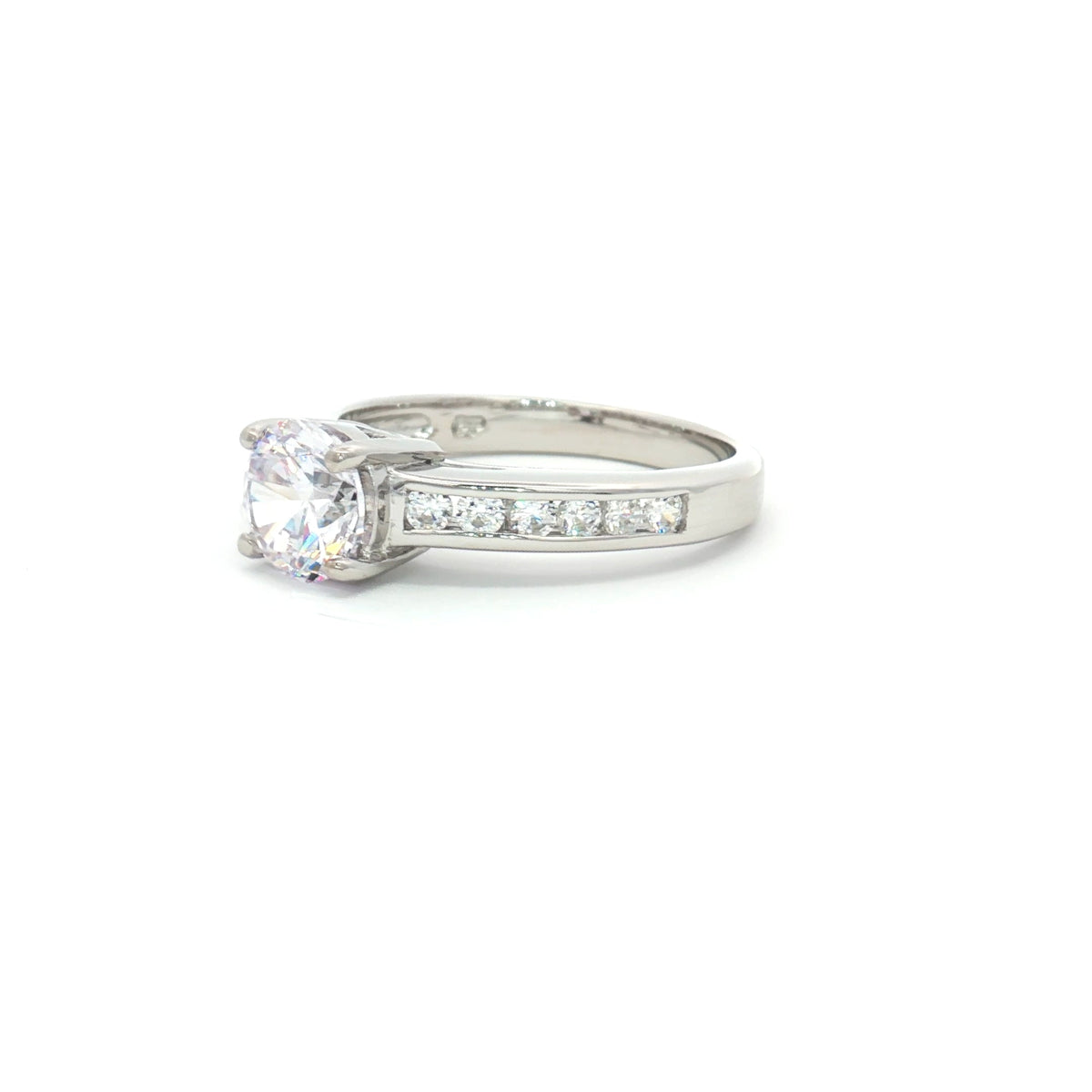 Petite Brilliant Cut Solitaire Ring with Princess Cut Channel Setting