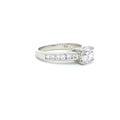 Petite Brilliant Cut Solitaire Ring with Princess Cut Channel Setting