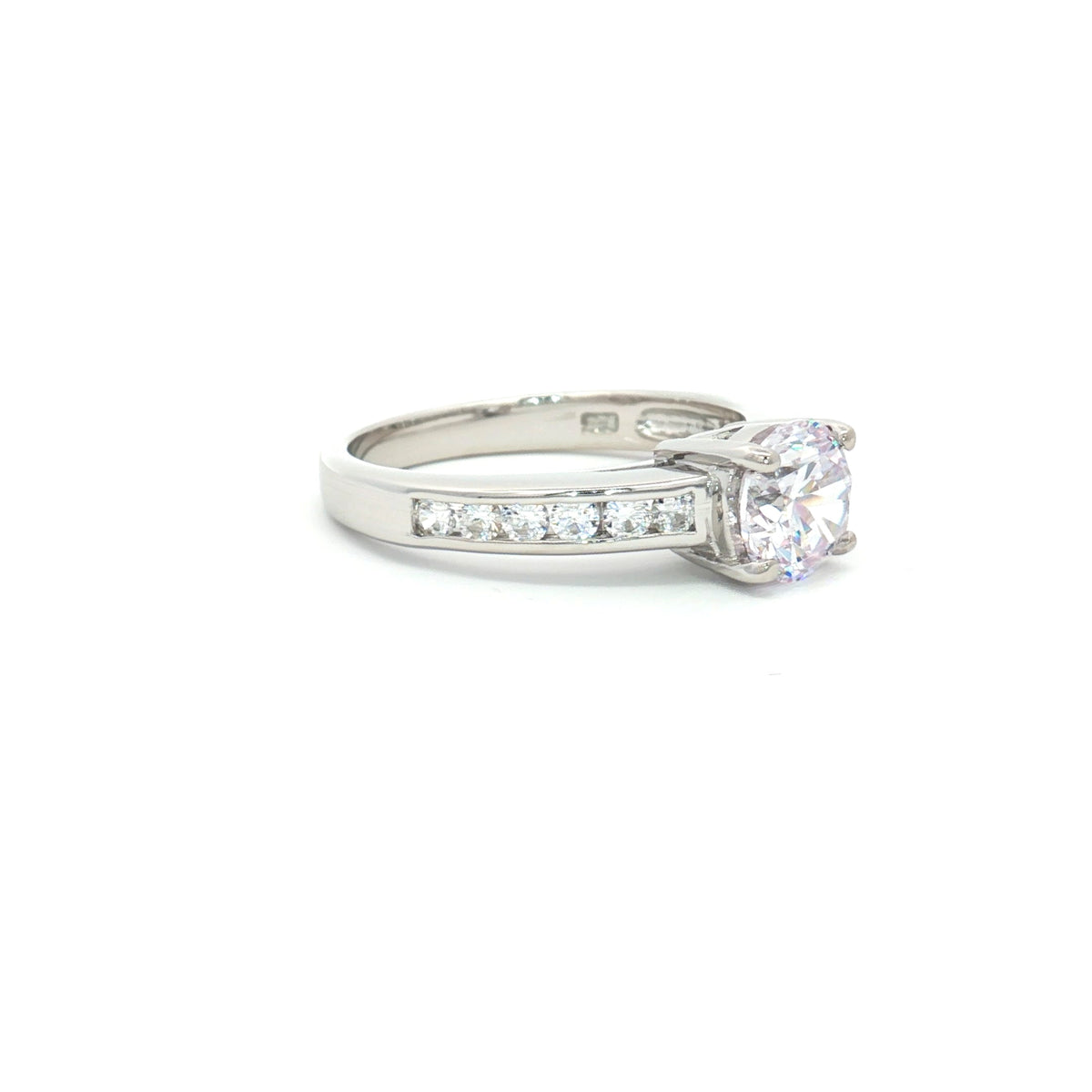 Petite Brilliant Cut Solitaire Ring with Princess Cut Channel Setting