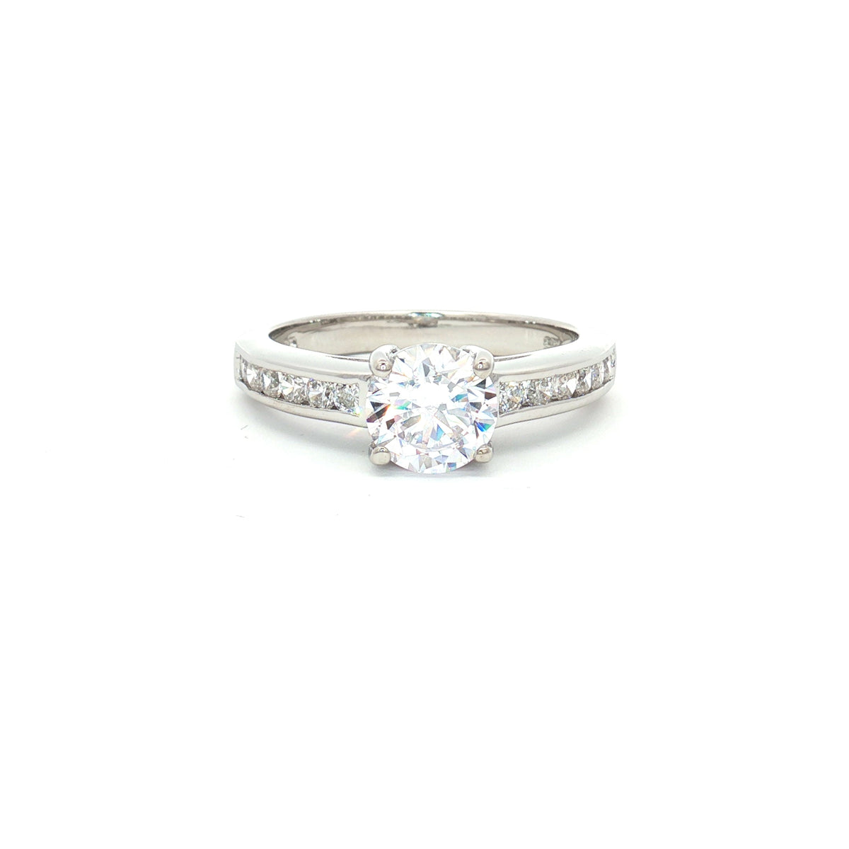 Petite Brilliant Cut Solitaire Ring with Princess Cut Channel Setting
