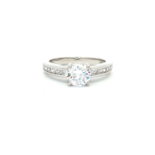 Petite Brilliant Cut Solitaire Ring with Princess Cut Channel Setting