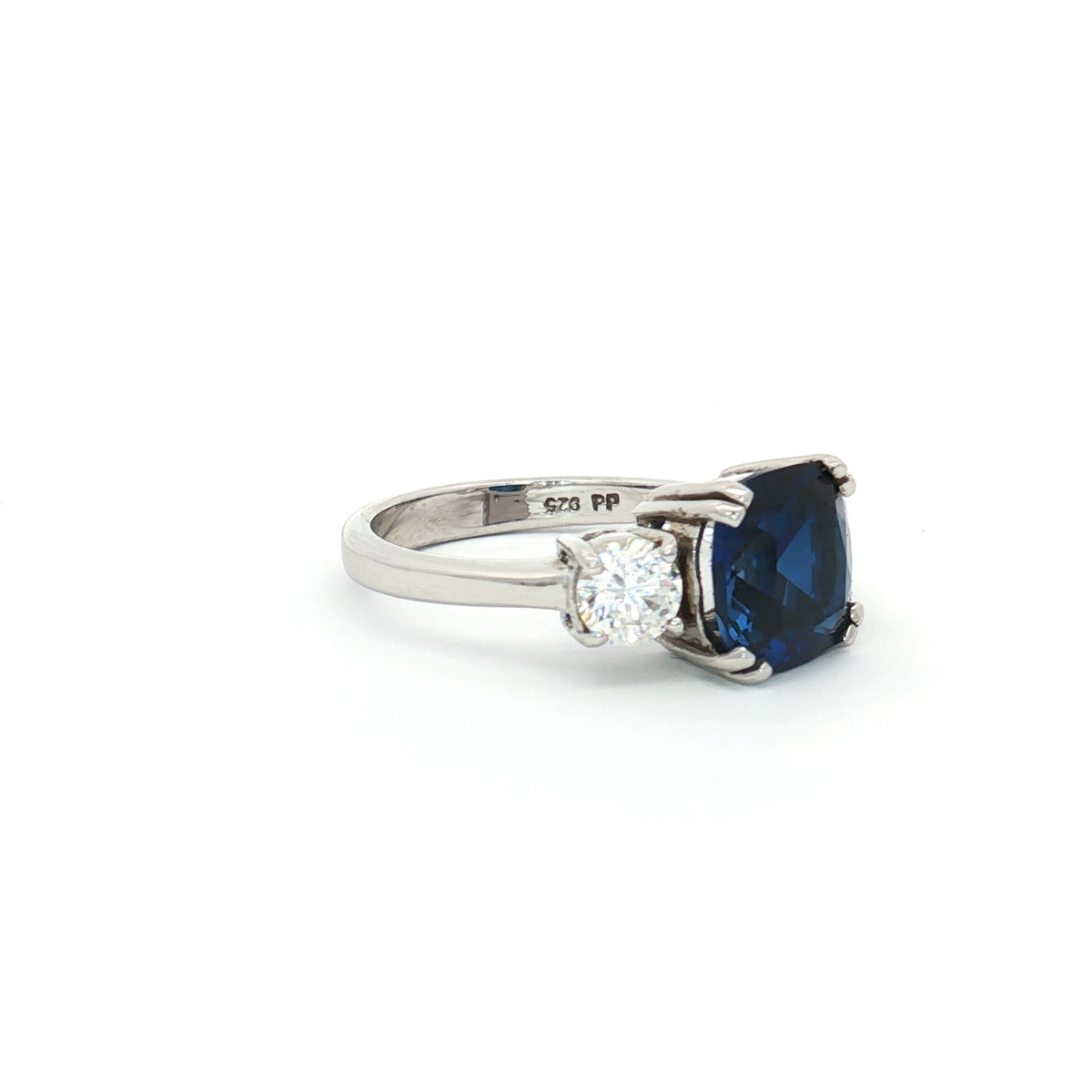 The Meghan Three Stone Ring with Sapphire Centre Stone
