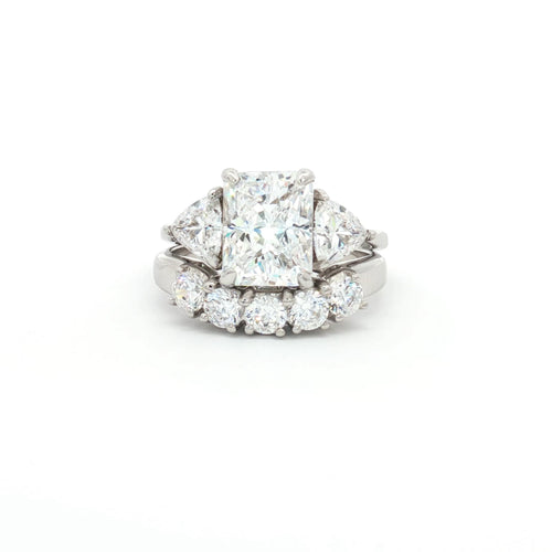 Radiant Cut Ring with Two Trillion Side Stones and Five Stone Curved Band