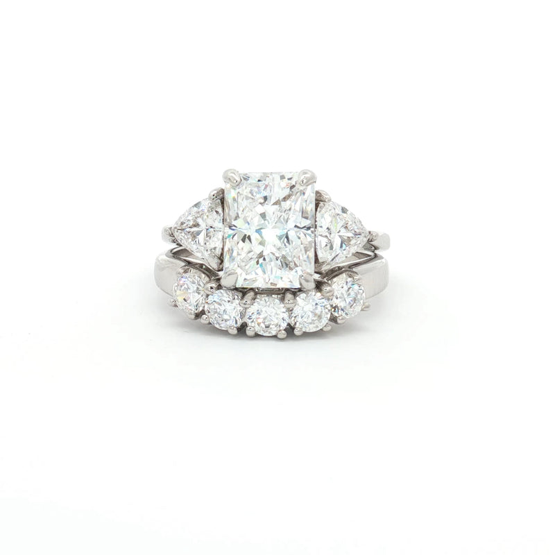 Radiant Cut Ring with Two Trillion Side Stones and Five Stone Curved Band