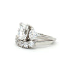 Radiant Cut Ring with Two Trillion Side Stones and Five Stone Curved Band