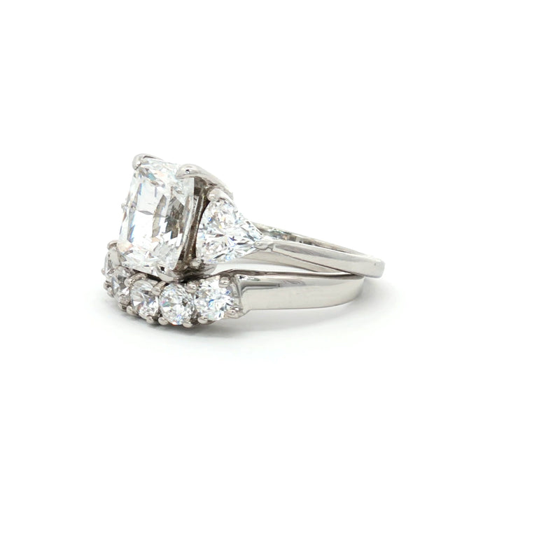 Radiant Cut Ring with Two Trillion Side Stones and Five Stone Curved Band