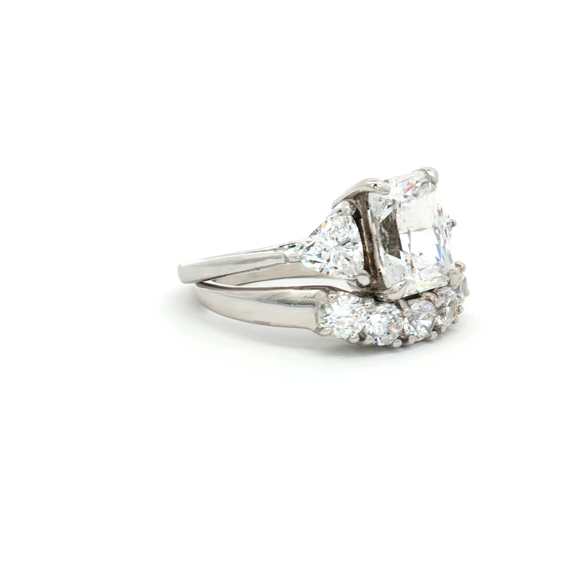 Radiant Cut Ring with Two Trillion Side Stones and Five Stone Curved Band