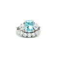 Radiant Cut Aqua Marine  Ring with Two Trillion Side Stones and Five Stone Curved Band