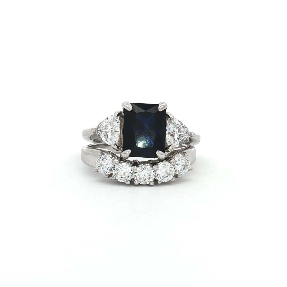 Radiant Cut Sapphire  Ring with Two Trillion Side Stones and Five Stone Curved Band