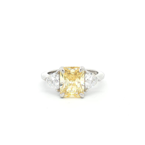 Radiant and Trillion Cut Ring with Yellow Stone
