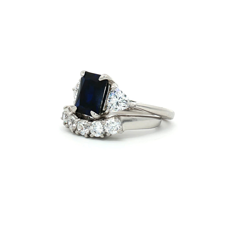 Radiant Cut Sapphire  Ring with Two Trillion Side Stones and Five Stone Curved Band