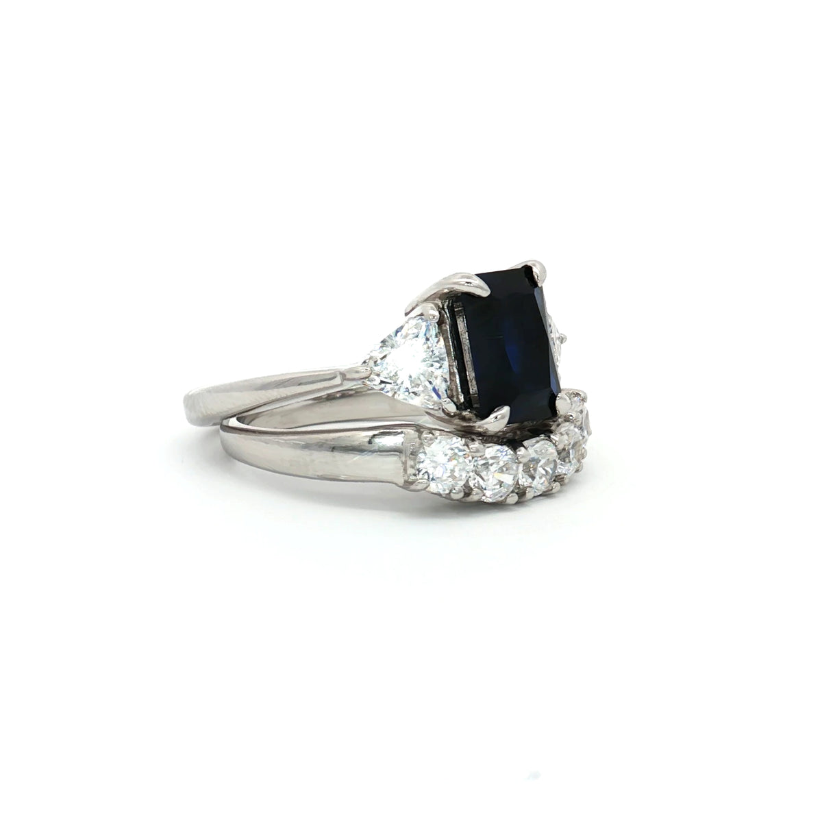 Radiant Cut Sapphire  Ring with Two Trillion Side Stones and Five Stone Curved Band
