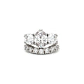 Oval Cut Ring with Two Brilliant Side Stones and Seven Stone Curved Band