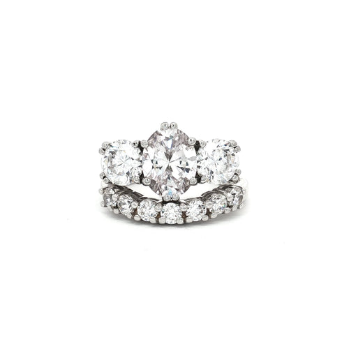 Oval Cut Ring with Two Brilliant Side Stones and Seven Stone Curved Band