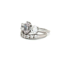 Oval Cut Ring with Two Brilliant Side Stones and Seven Stone Curved Band