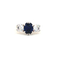 Oval Cut Ring with Two Brilliant Side Stones with Sapphire Centre Stone
