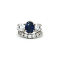 Oval Cut Sapphire  Ring with Two Brilliant Side Stones and Seven Stone Curved Band
