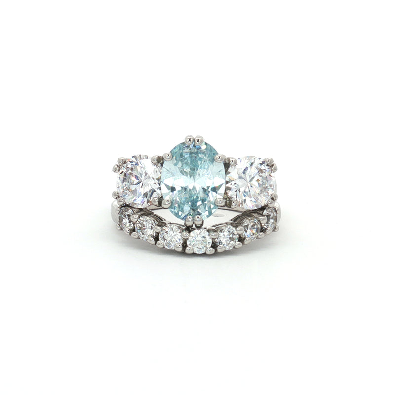 Oval Cut Aqua Marine Ring with Two Brilliant Side Stones and Seven Stone Curved Band