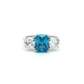 Radiant Cut Ring with Two Brilliant Side Stones and Topaz Centre Stone