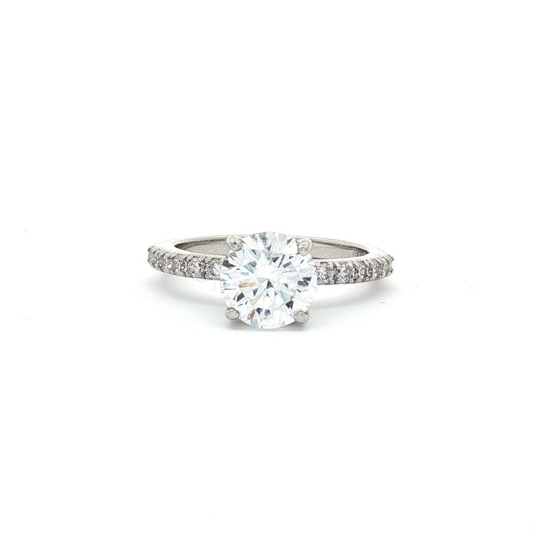 Brilliant Cut Solitaire with Pave Setting