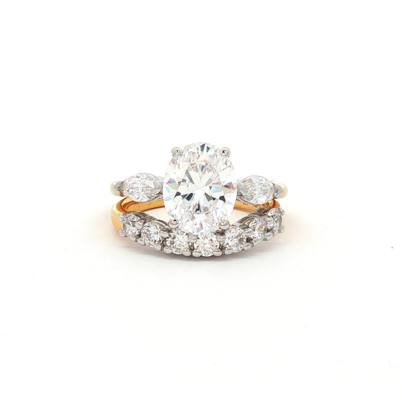 Oval Cut Ring with Marquise Side Stones and Seven Stone Curved Band